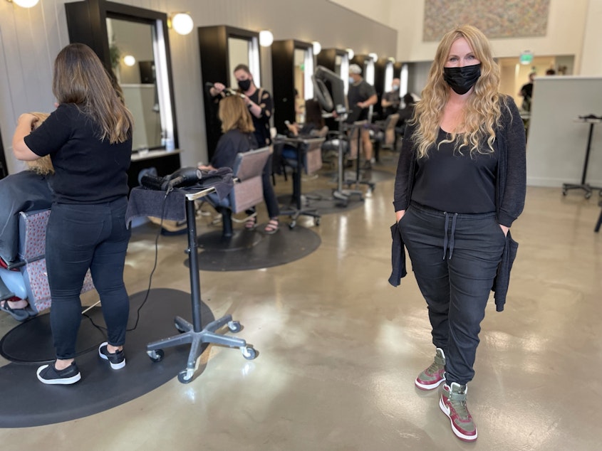 caption: Becca Stordahl, one of the owners of Robert Leonard Salon across the street from Amazon's HQ