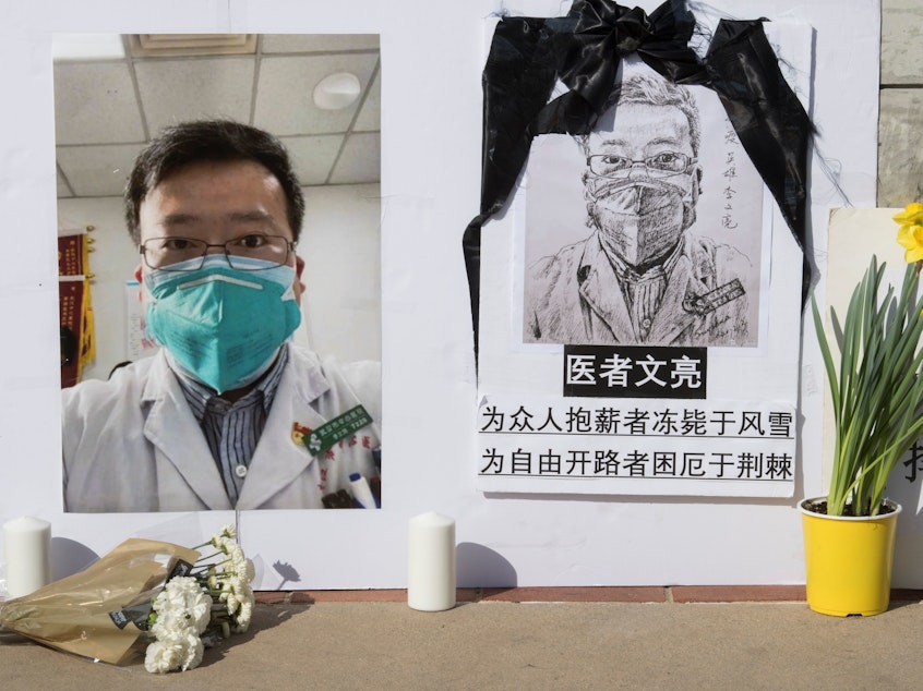caption: A memorial for whistleblower Li Wenliang sits on UCLA's campus in Southern California last month. Chinese authorities are now apologizing for the reprimand that the doctor received after warning of the coronavirus.
