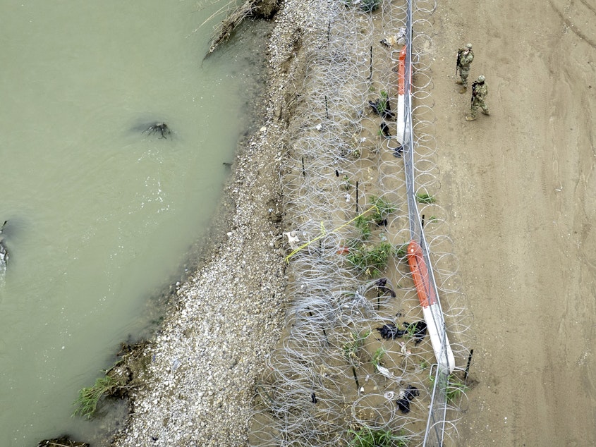 caption: Texas National Guard soldiers are seen guarding the U.S.-Mexico border in Eagle Pass, Texas.