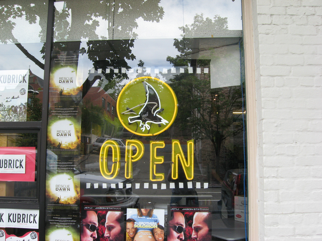 caption: The sign at Scarecrow says "open" -- and many hope it will stay that way as the iconic video store transitions into a nonprofit.