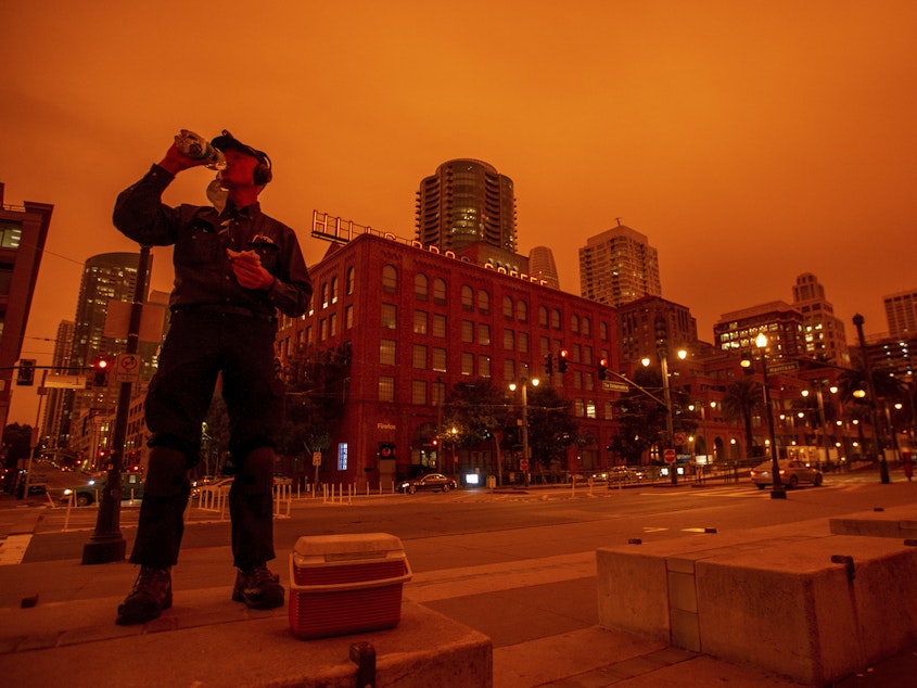 caption: Smoky skies cast a reddish glow to San Francisco skies when the northern California wildfires were burning earlier this year.