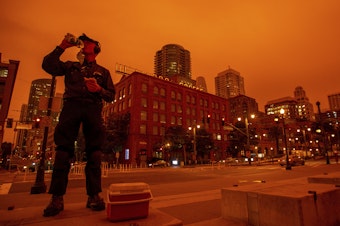 caption: Smoky skies cast a reddish glow to San Francisco skies when the northern California wildfires were burning earlier this year.