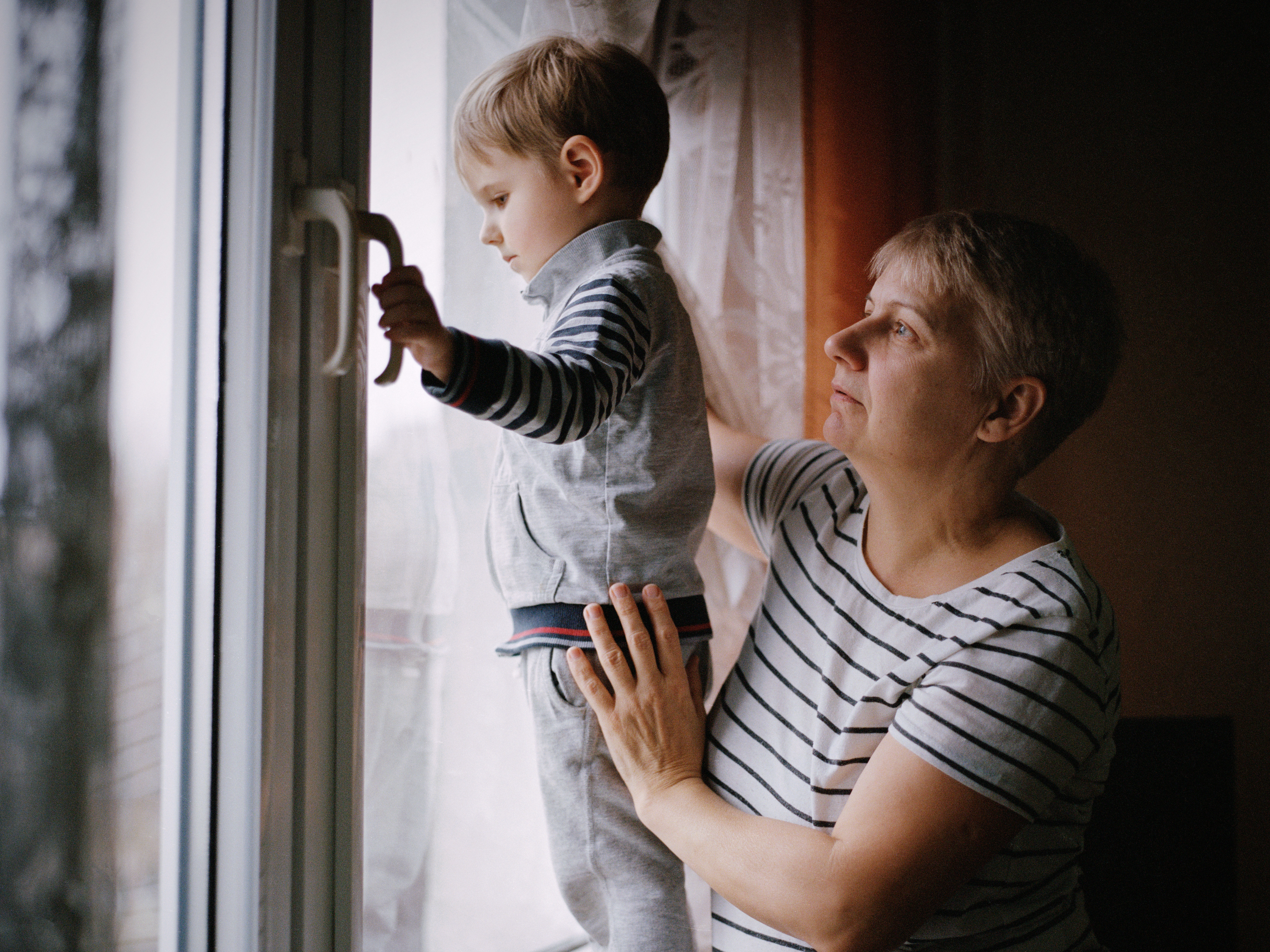 caption: Elena Diachkova and her grandson Nikita, 3, in Poland. December 2022.