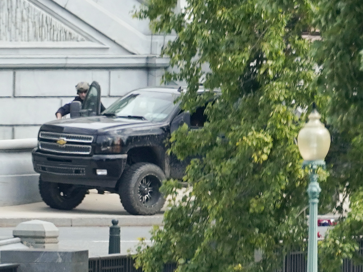caption: A man who claimed to have a bomb in a pickup truck near the Capitol surrendered to law enforcement after an hours-long standoff Thursday. The incident prompted a massive police response and the evacuations of government buildings and businesses in the area.