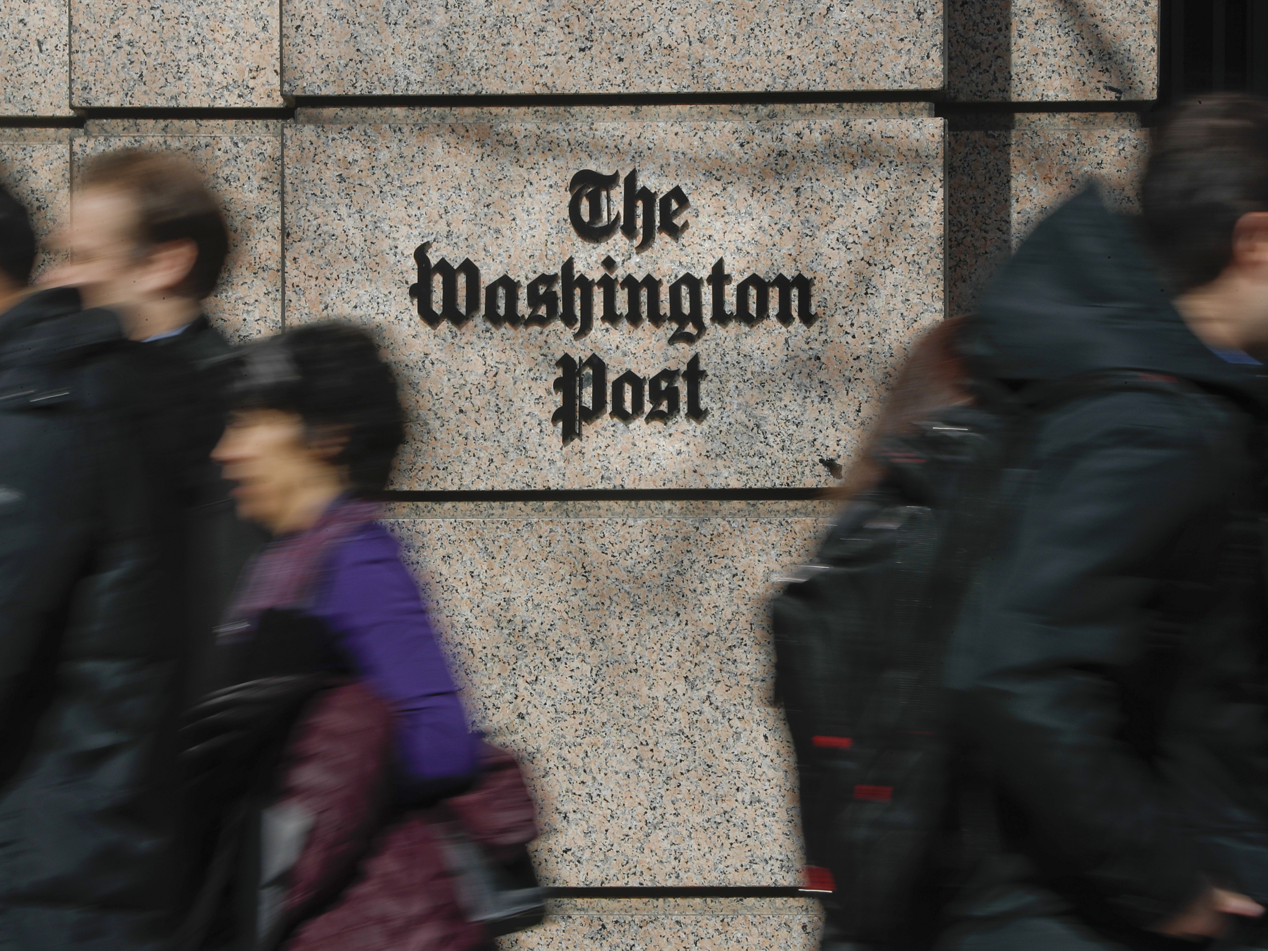 caption: More than 750 <em>Washington Post</em> workers have agreed to walk off the job on Thursday to protest stalled contract negotiations. The company has warned of layoffs if too few staffers take voluntary buyouts.