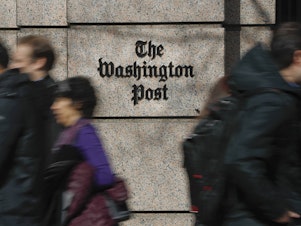 caption: More than 750 <em>Washington Post</em> workers have agreed to walk off the job on Thursday to protest stalled contract negotiations. The company has warned of layoffs if too few staffers take voluntary buyouts.