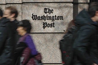 caption: More than 750 <em>Washington Post</em> workers have agreed to walk off the job on Thursday to protest stalled contract negotiations. The company has warned of layoffs if too few staffers take voluntary buyouts.
