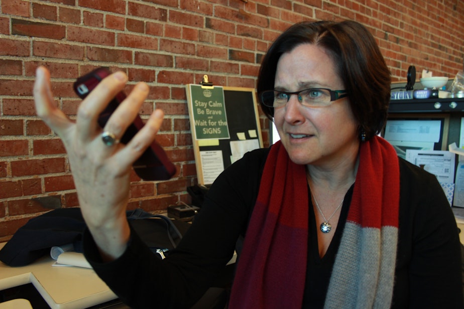 caption: A frequent sight in our newsroom: Business reporter Carolyn Adolph arguing with Siri, the iPhone personal assistant.