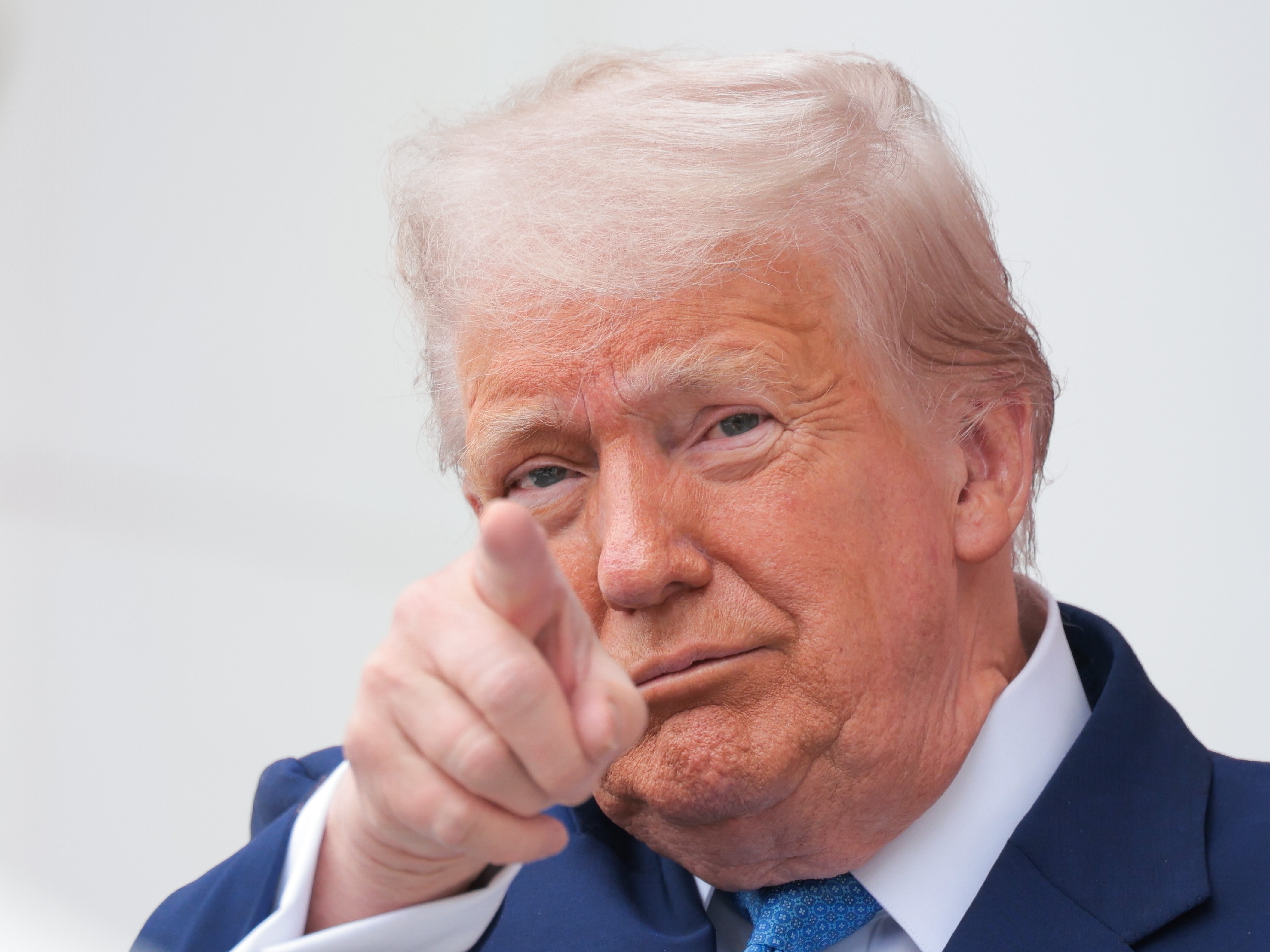 caption: President Trump speaks during the Memorial Day ceremony at Arlington National Cemetery on May 26, 2025.
