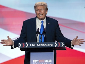 caption: Former President Donald Trump speaks at an event in Washington on September 15.