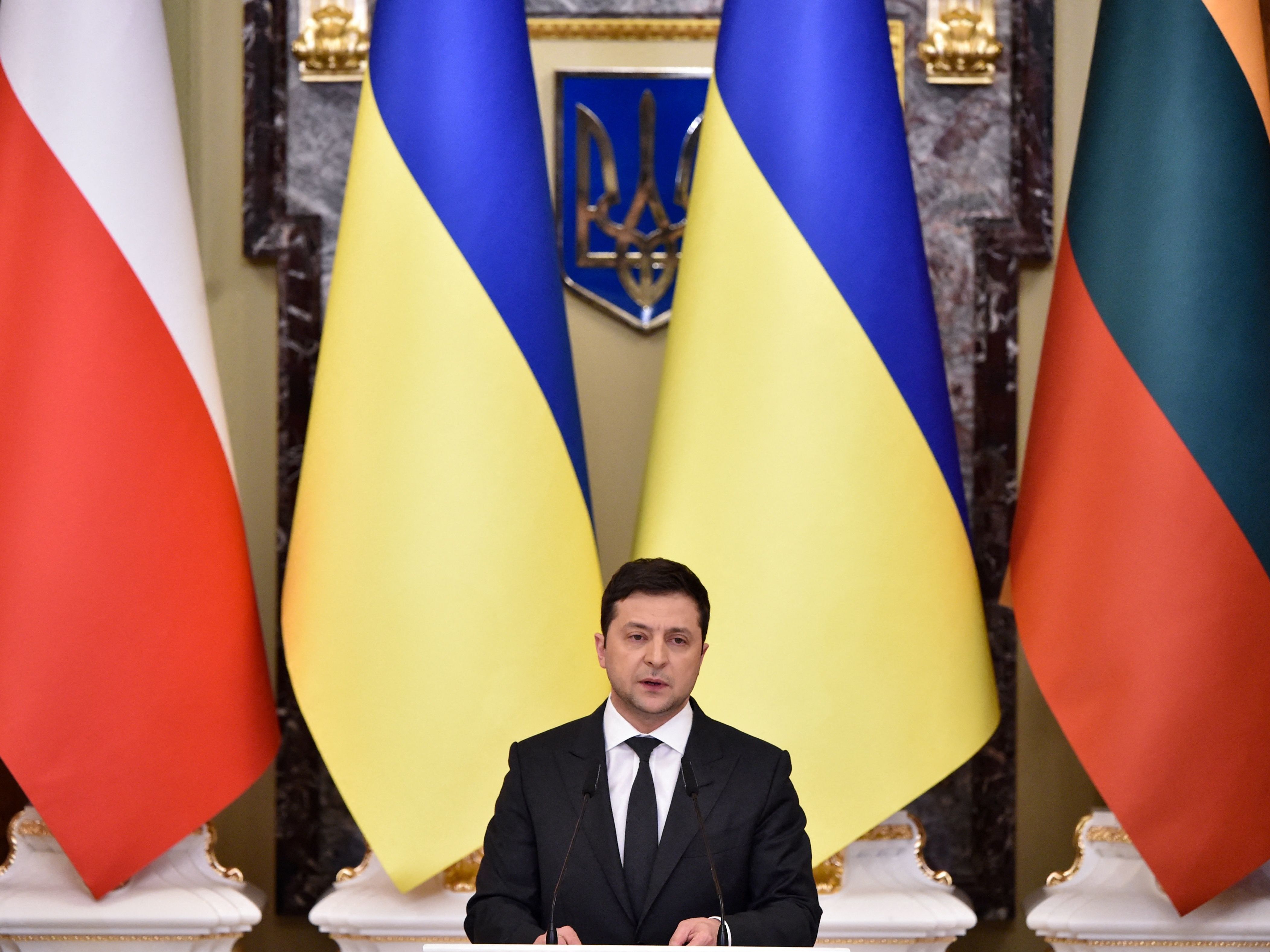 caption: Ukrainian President Volodymyr Zelenskyy, shown here at a  press conference Wednesday, is moving to declare a state of emergency.
