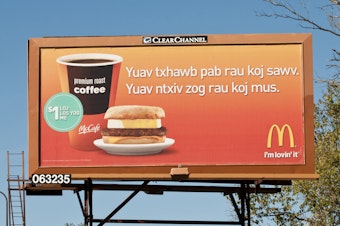 caption: A McDonald's billboard in St. Paul, Minn., advertises in the Hmong language. A new study of first- and second-generation Hmong and Karen immigrants finds their gut microbiomes changed soon after moving to the U.S.