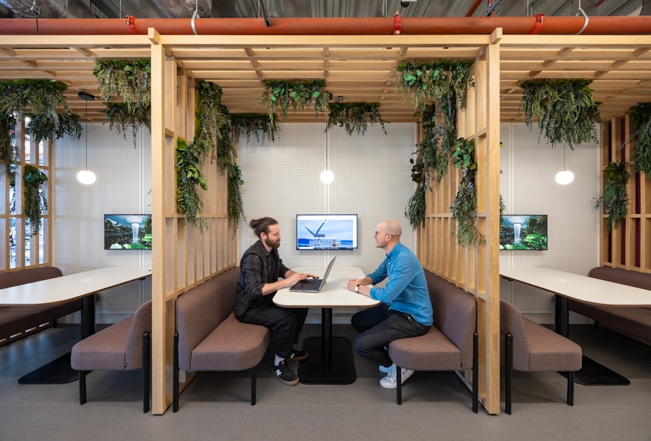 caption: A workplace designed by HOK for the global engineering firm Arup in Birmingham, England. The redesign incorporates "biophelia," colors, patterns, and elements to make people feel closer to nature.