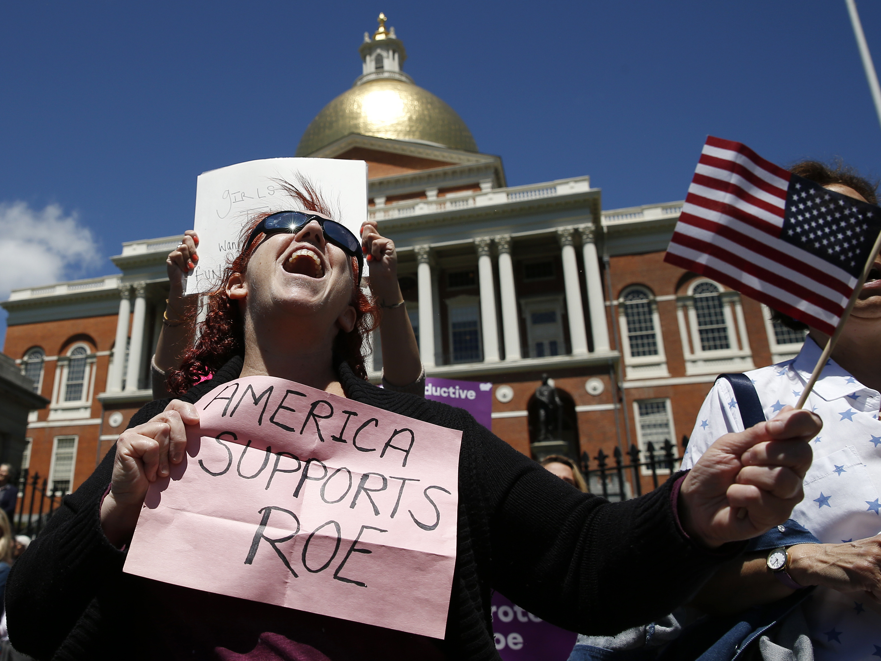 caption: Women's rights activists, including Jane Marcus of Medford, pictured in May, have been urging the legislature to pass a law that codifies abortion rights in state law.