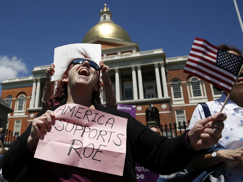 caption: Women's rights activists, including Jane Marcus of Medford, pictured in May, have been urging the legislature to pass a law that codifies abortion rights in state law.