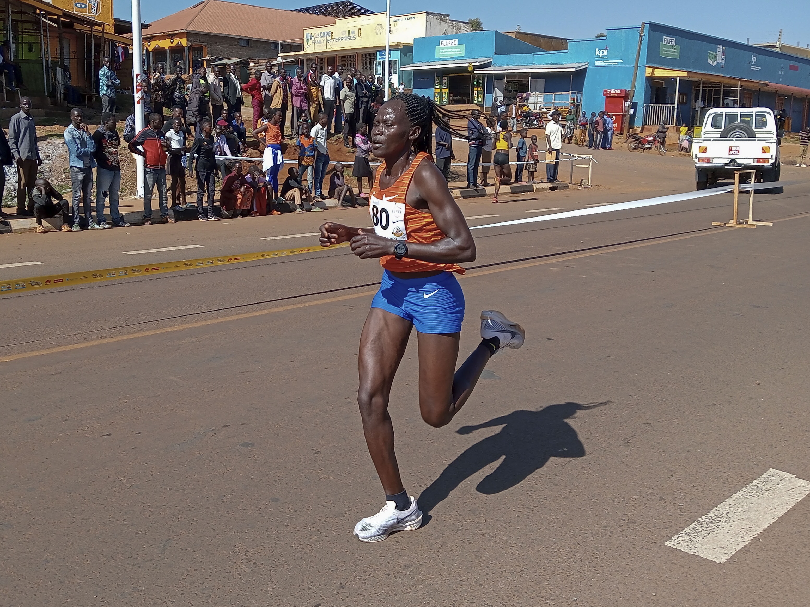 caption: Rebecca Cheptegei is seen competing at the Discovery 10km road race in Kapchorwa, Uganda, on Jan. 20, 2023.