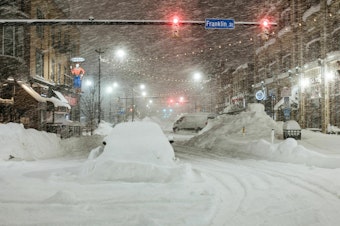 caption: Vehicles are seen abandoned in heavy snowfall in downtown Buffalo, New York, on Monday. Emergency crews counted the grim costs of a colossal winter storm that brought Christmas chaos to the U.S., especially in hard-hit western New York.