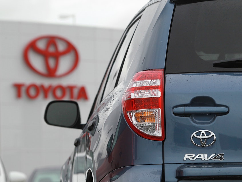 caption: A Toyota RAV4 sits on the sales lot at a Toyota dealership in February 2011 in Oakland, Calif.