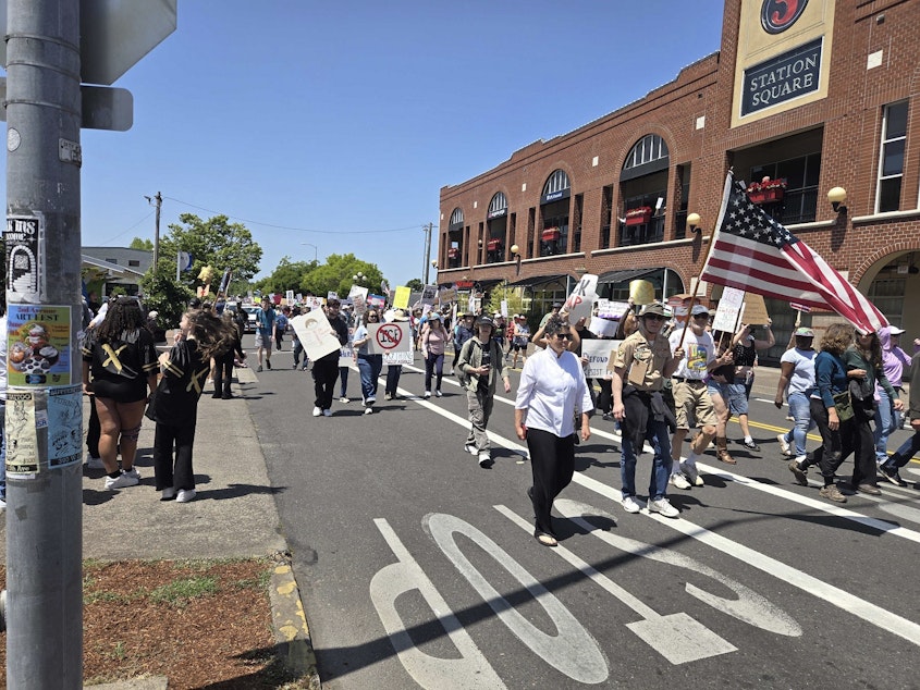 caption: The No Kings protest as it goes down 5th Ave in Eugene, Oregon, on June 14, 2025.