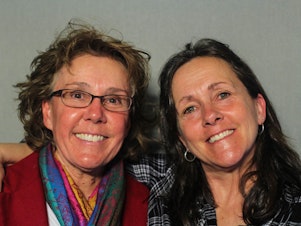 caption: Lori Daigle, 55, and Liz Barnez, 54, at StoryCorps in Fort Collins, Colo.