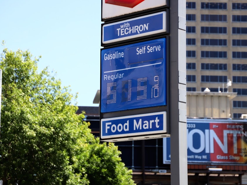 caption: Gas price board at a gas station in Seattle's University District on July 19, 2023.
