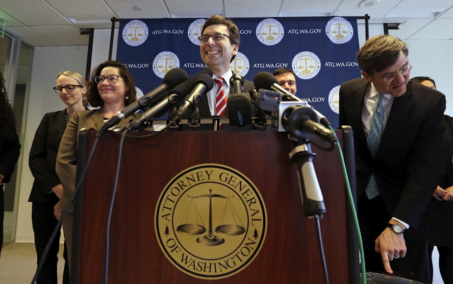 caption: Washington state Attorney General Bob Ferguson smiles during a news conference about President Trump's new executive order Monday, March 6, 2017, in Seattle. The new ban, which takes effect March 16, halts travel for 90 days for residents of Iran, Libya, 
