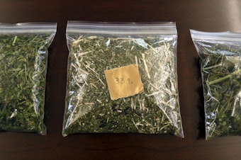 caption: Samples of hemp sit on a table in the conference room at Andrew Ross' office in Denver on Friday, March 22, 2019. Ross, a Marine who served in Afghanistan and Iraq, is facing 18 years to life in Oklahoma if he is convicted after he was arrested in January while providing security for a load of state-certified hemp from Kentucky. Federal legalization for hemp has created a quandary for police as authorities lack the technology to distinguish marijuana from agricultural hemp at a roadside stop. CREDIT: THOMAS