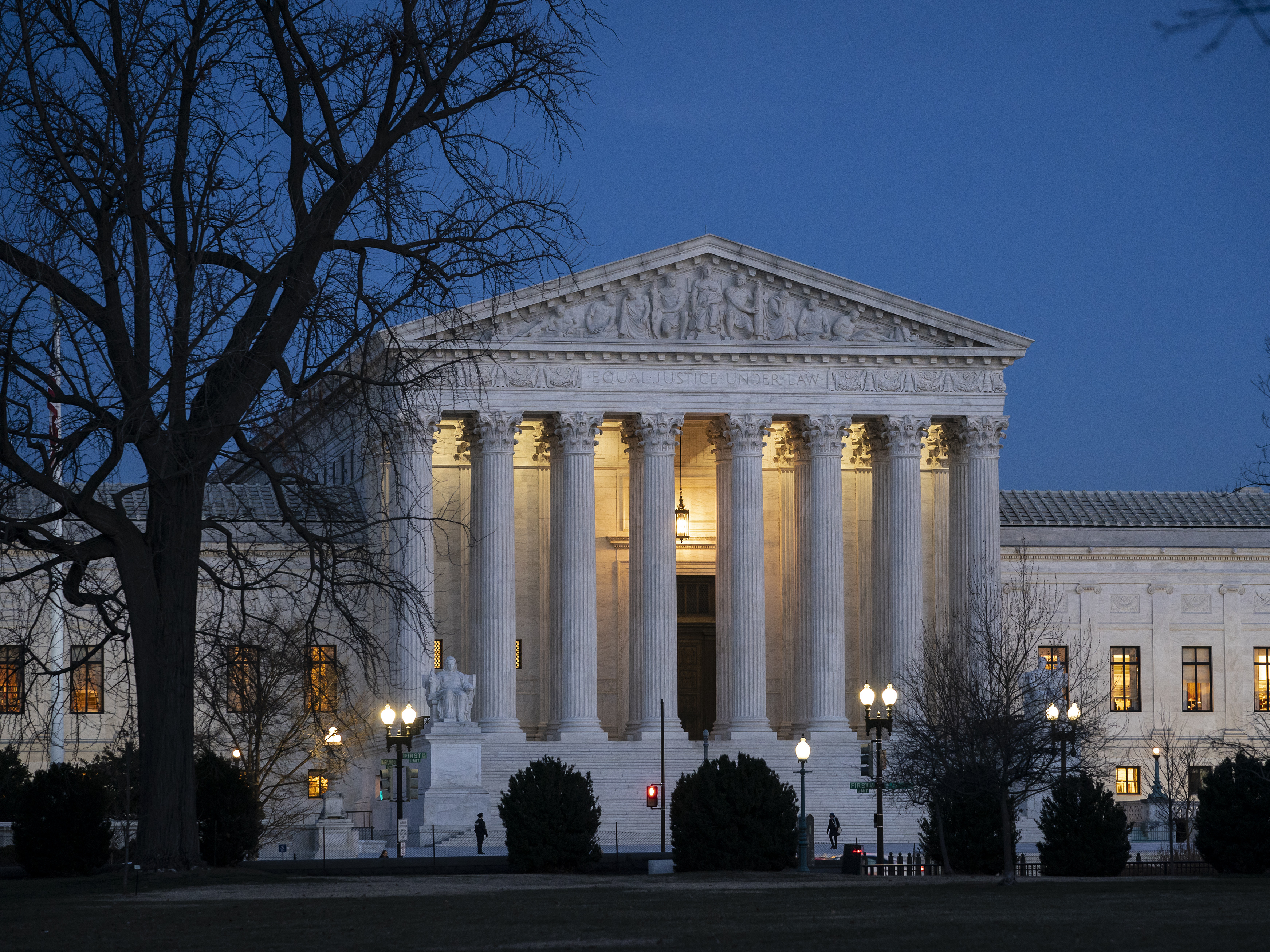 caption: In May, the Supreme Court began hearing oral arguments by teleconference for the first time because of the pandemic.