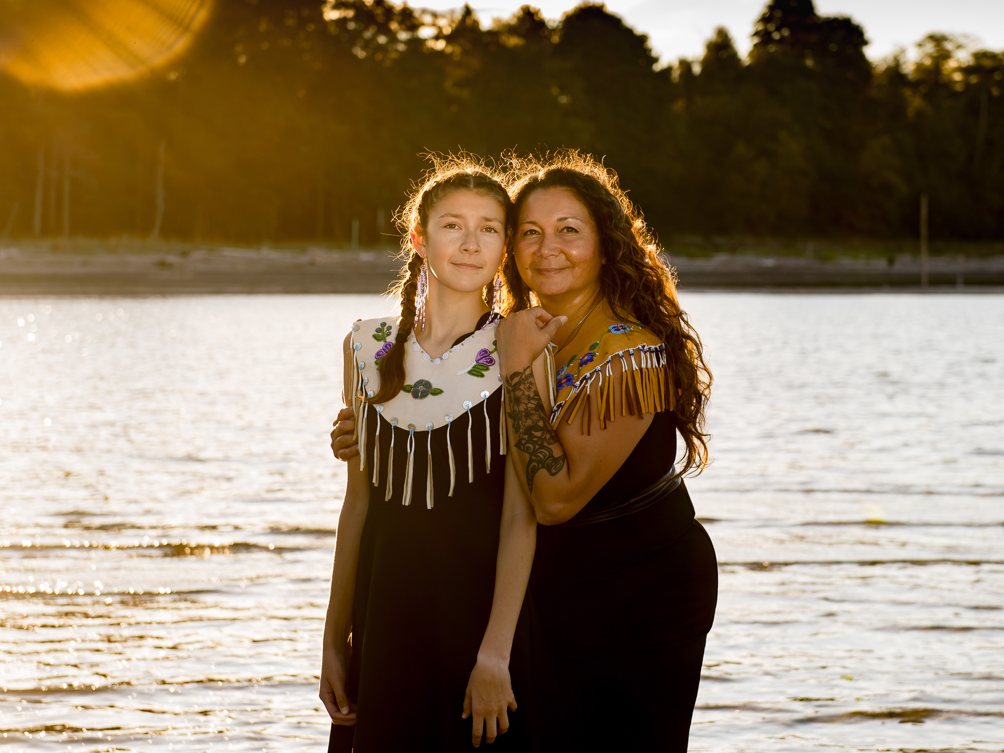 caption: Danita Bilozaze, alongside her daughter Dani, celebrated the completion of her master's degree in education with a portrait session last year at Kye Bay in Comox Valley, British Columbia. Bilozaze's studies focused on Indigenous language revitalization.