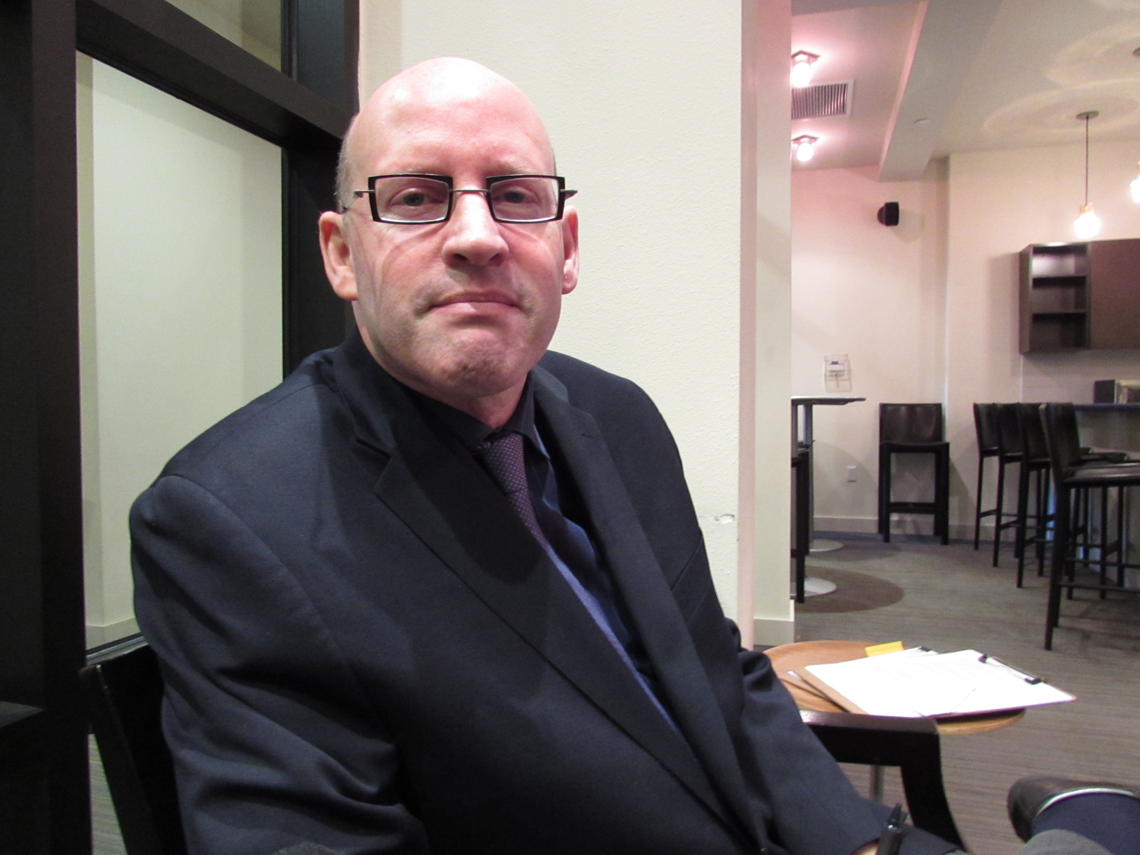 caption: David Combs' anti-1491 effort doesn't have an office, he does media interviews in the lobby of his condo in Redmond.