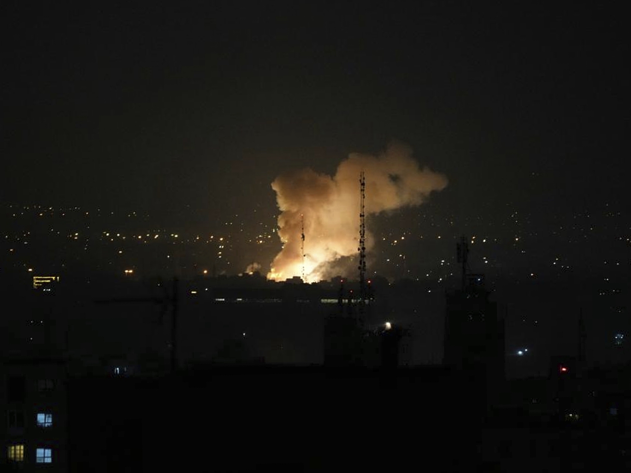 caption: Smoke rises after an explosion in Tehran, Iran, Friday, June 13, 2025. Israel attacked Iran's capital early Friday, with explosions booming across Tehran.