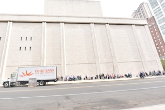 caption: Food Bank For New York City hosts a pop-up food pantry during Hunger Action Month at Lincoln Center on September 24, 2020.