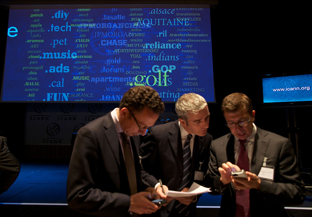 caption: Journalists examine new 'Generic Top-Level Domain Names (gTLDs) during a press conference hosted by ICANN in central London, on June 13, 2012. The US-based Internet Corporation for Assigned Names and Numbers (ICANN) was to reveal details of 1,930 requests for new web address endings at a press conference in London. The California-based body says the huge expansion of the Internet, with two billion users around the world, half of them in Asia, means the new names are essential.(Andrew Cowie/AFP/GettyImages)