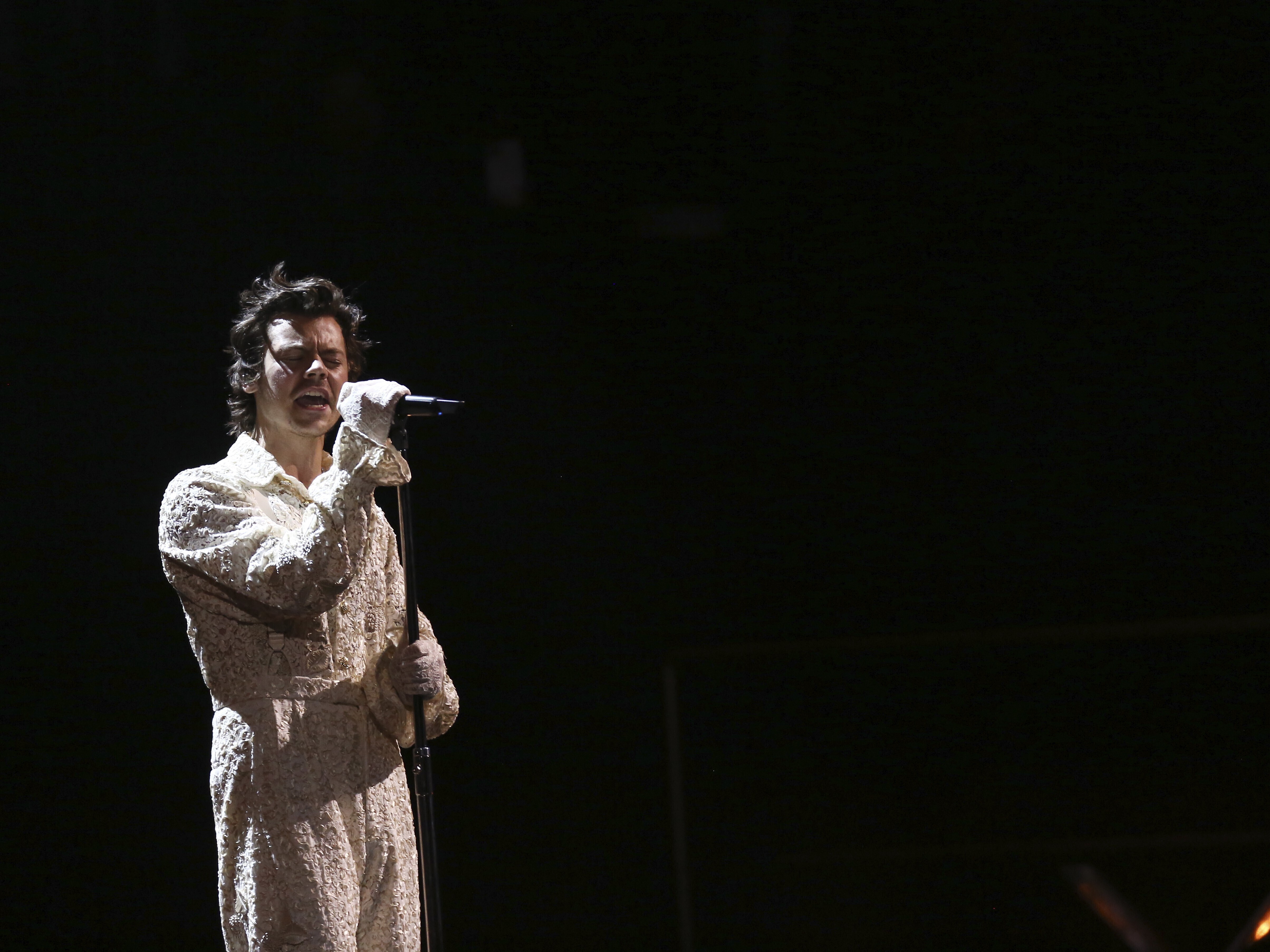 caption: Harry Styles performs on stage at the Brit Awards 2020 in London, Tuesday, Feb. 18, 2020.