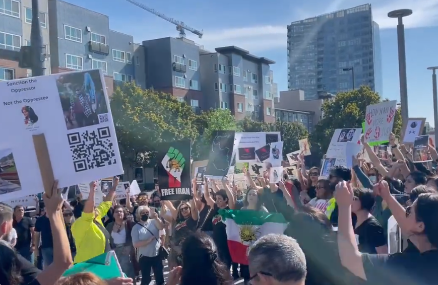 caption: Demonstrators in Bellevue on Sept. 26, 2022, protesting the death of Mahsa Amini earlier in the month. Amini was arrested by the country's morality police for allegedly not wearing her hijab properly. She died in police custody days later. 