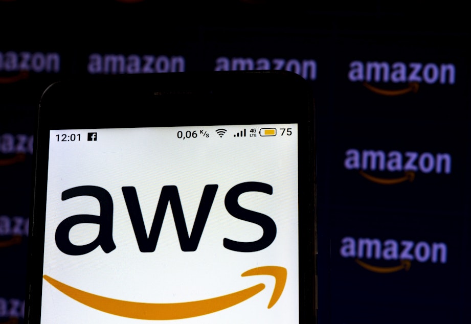 caption: An Amazon Web Services logo seen displayed on a smartphone screen. (Igor Golovniov/SOPA Images/LightRocket via Getty Images)