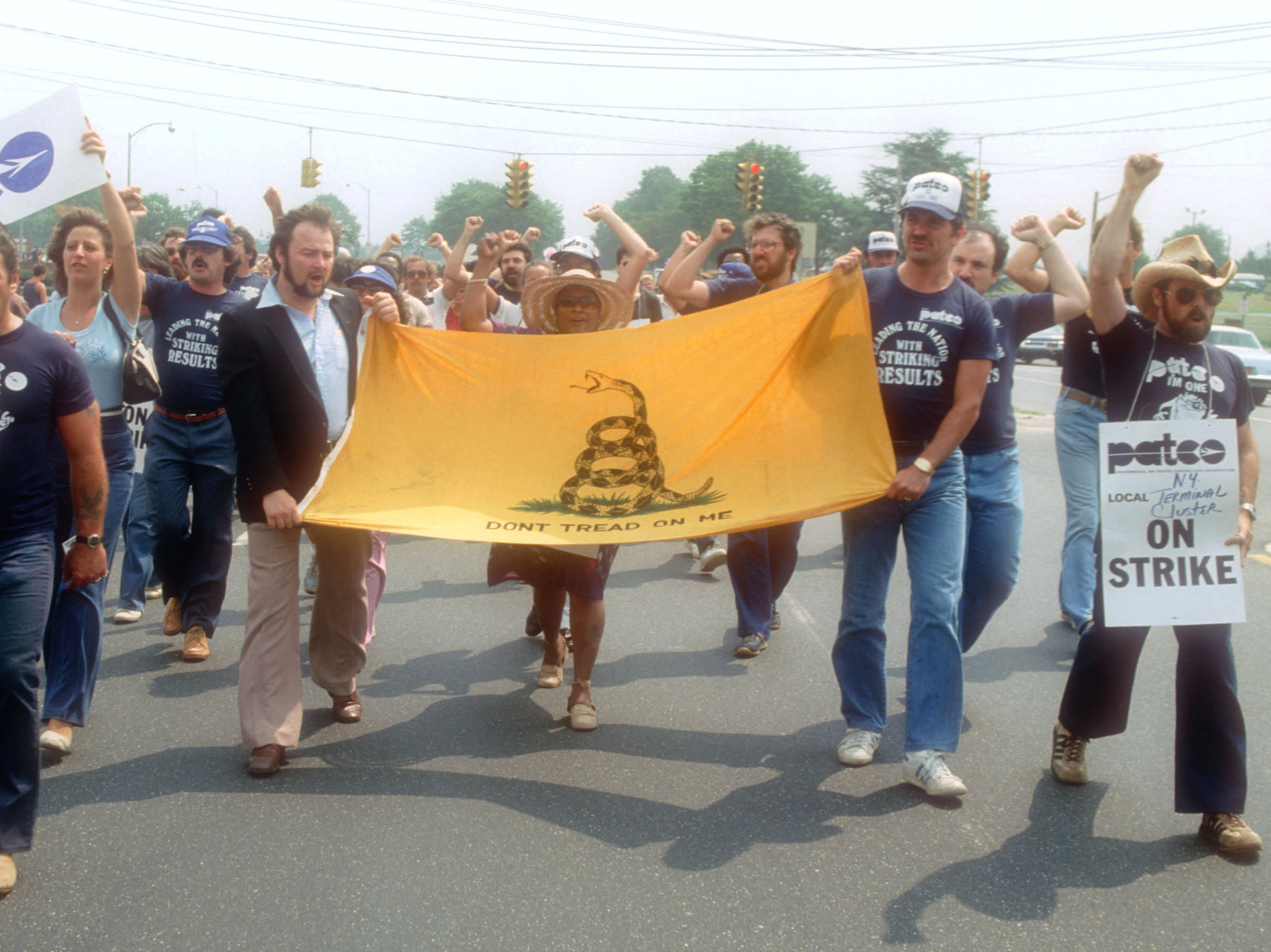 caption: Striking members of the Professional Air Traffic Controllers Organization hold a rally on Aug. 6, 1981, on Long Island, N.Y. Nearly 13,000 air-traffic controllers walked off the job and most were fired by President Ronald Reagan after refusing to return to work.