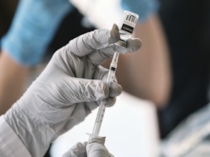 caption: Registered pharmacist Sapana Patel, loads a syringe with monkeypox vaccine at a pop-up vaccination site on Wednesday, Aug. 3, 2022, in West Hollywood, Calif.