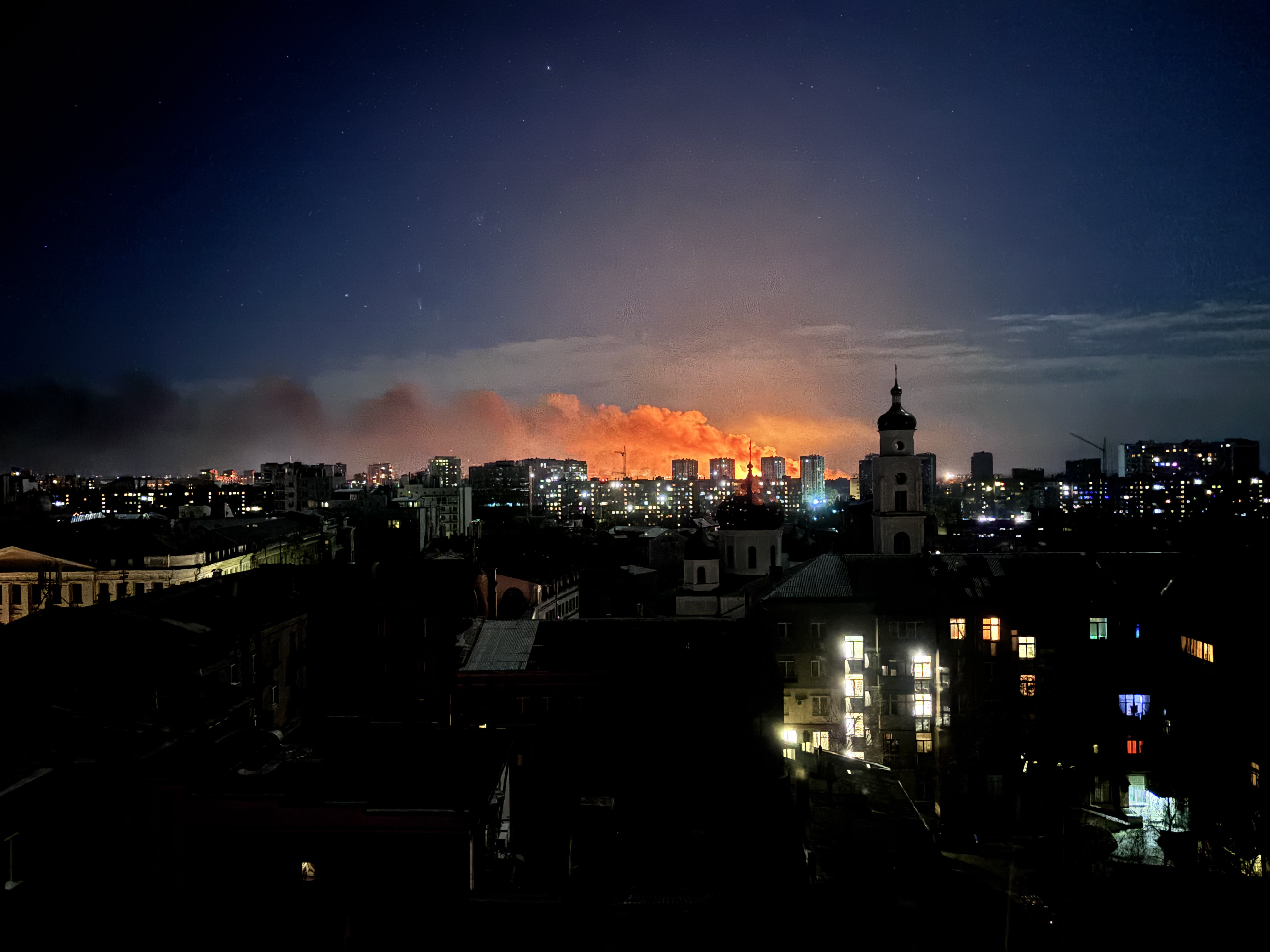 caption: A missile strike in Kharkiv, Ukraine.