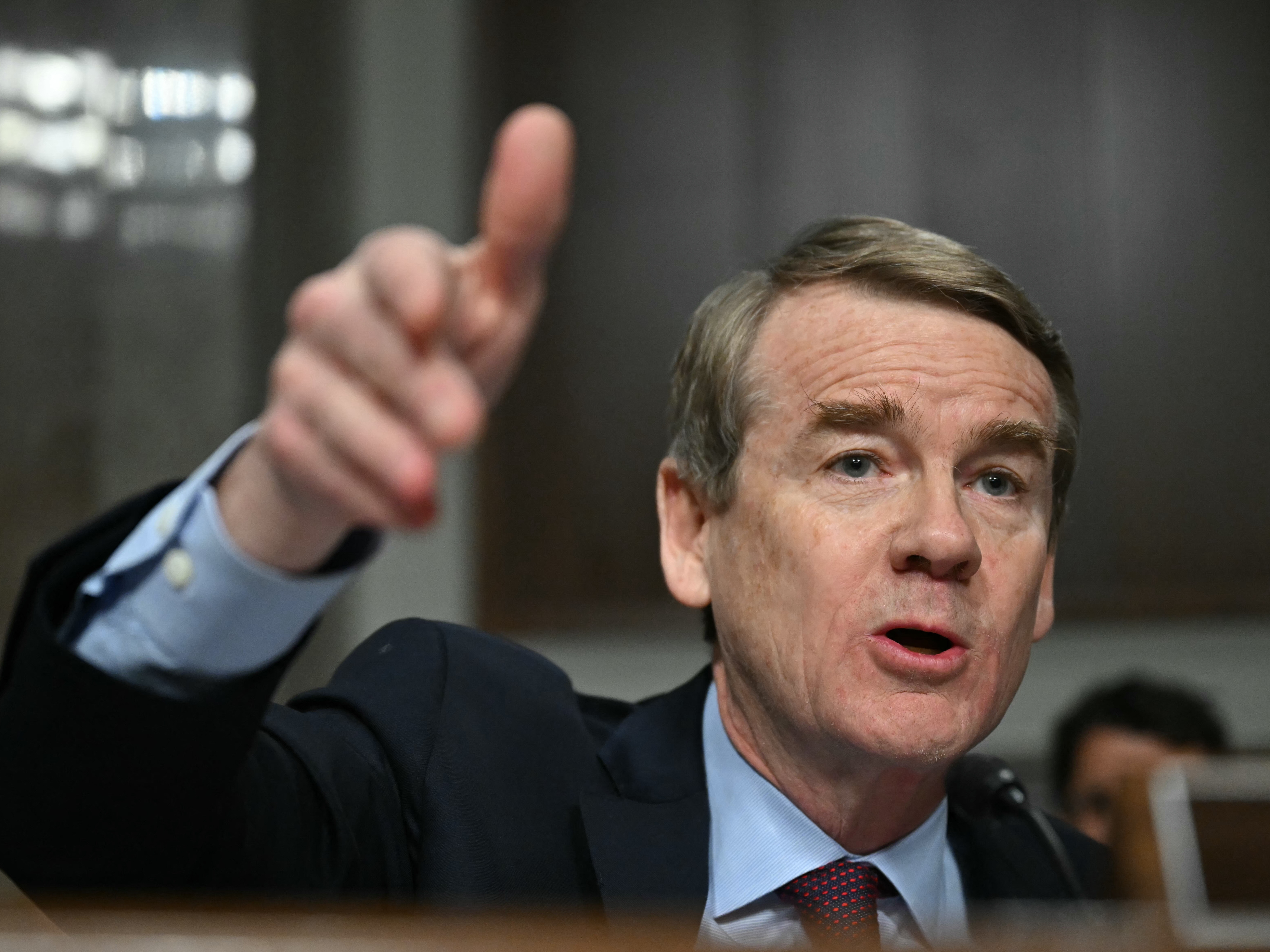 caption: U.S. Senator Michael Bennet, Democrat from Colorado, is shown Jan. 29, 2025, questioning Robert F. Kennedy Jr. during a Senate Finance Committee hearing on Kennedy's nomination to be health and human services secretary.