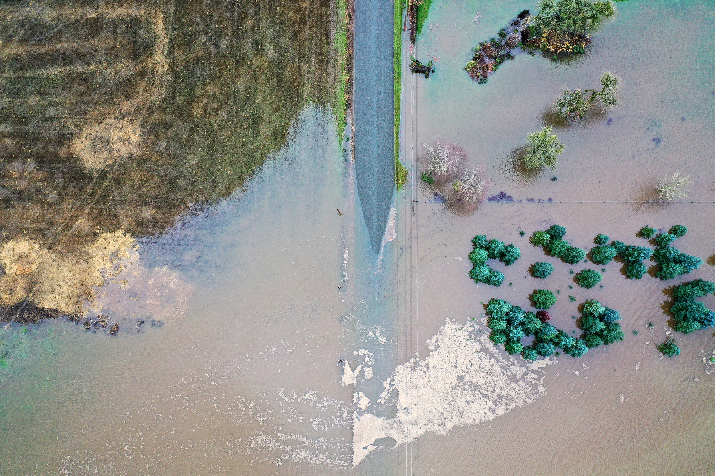 caption: Floodwaters close Babcock Road near the intersection of SR 9 on Thursday, December 11, 2025, near Mount Vernon. 