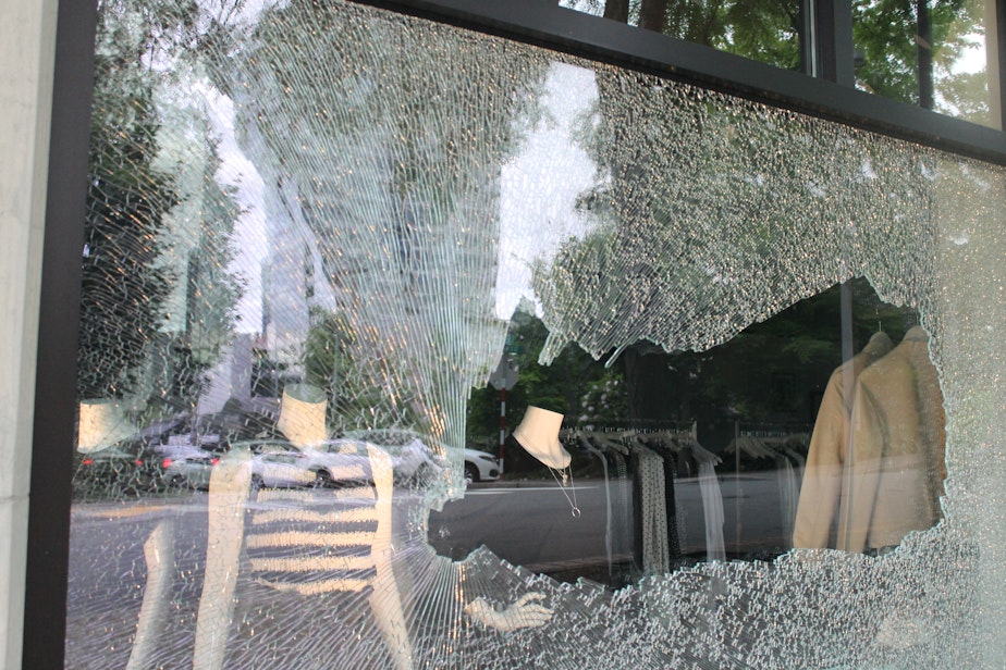 caption: A smashed window at Smith & Main, a business in downtown Bellevue on Sunday, May 31, 2020. 
