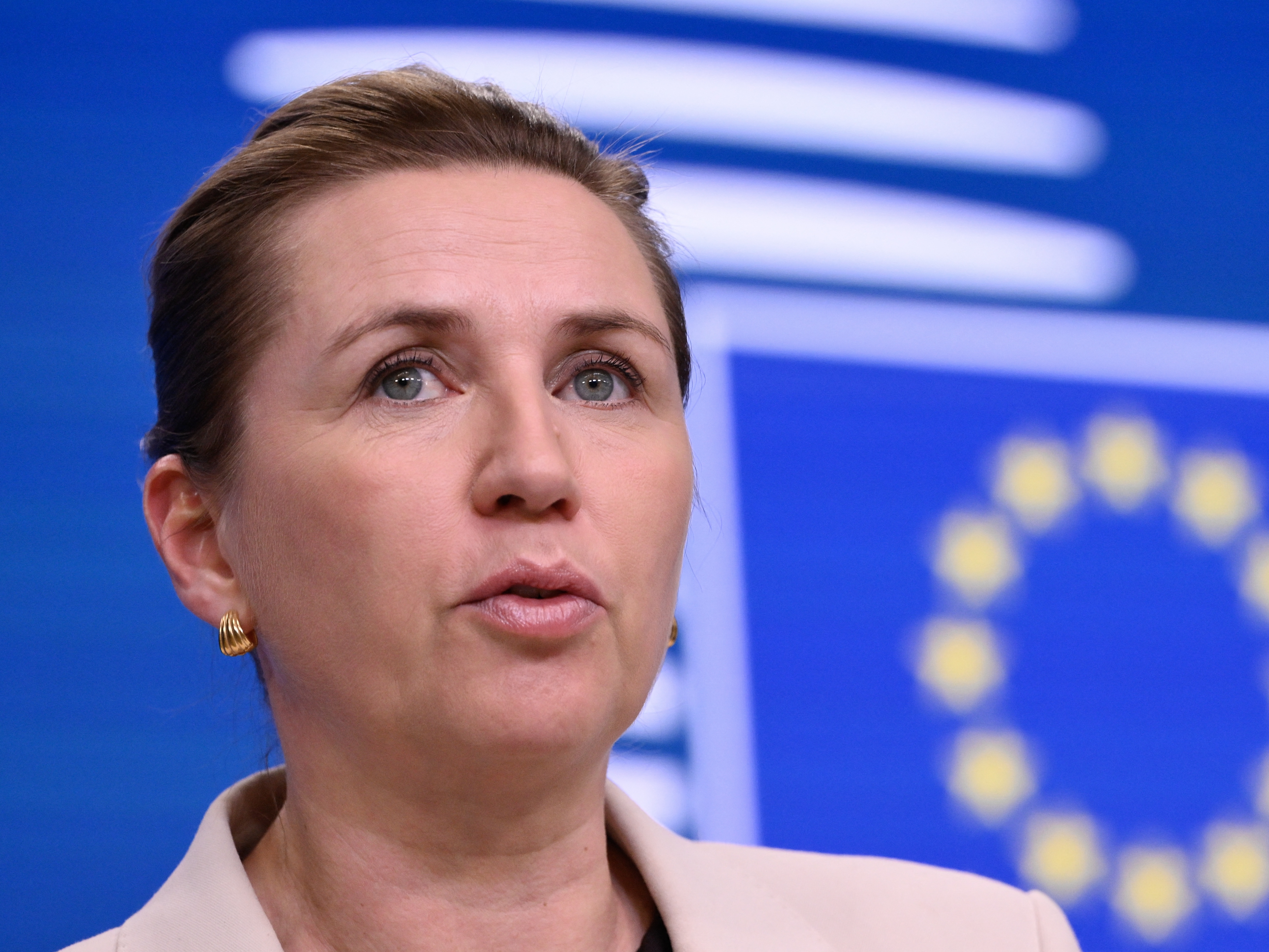 caption: Denmark's Prime Minister Mette Frederiksen speaks at a press conference in Brussels, Belgium on Dec. 19. She says the U.S. should stop threatening to annex Greenland.