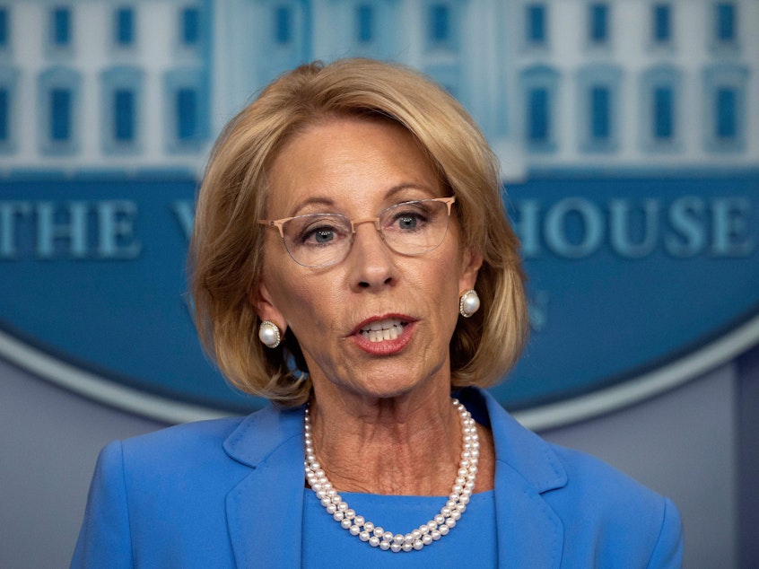 caption: Secretary of Education Betsy Devos, seen on March 27, has released new rules for sexual assault complaints on college campuses.