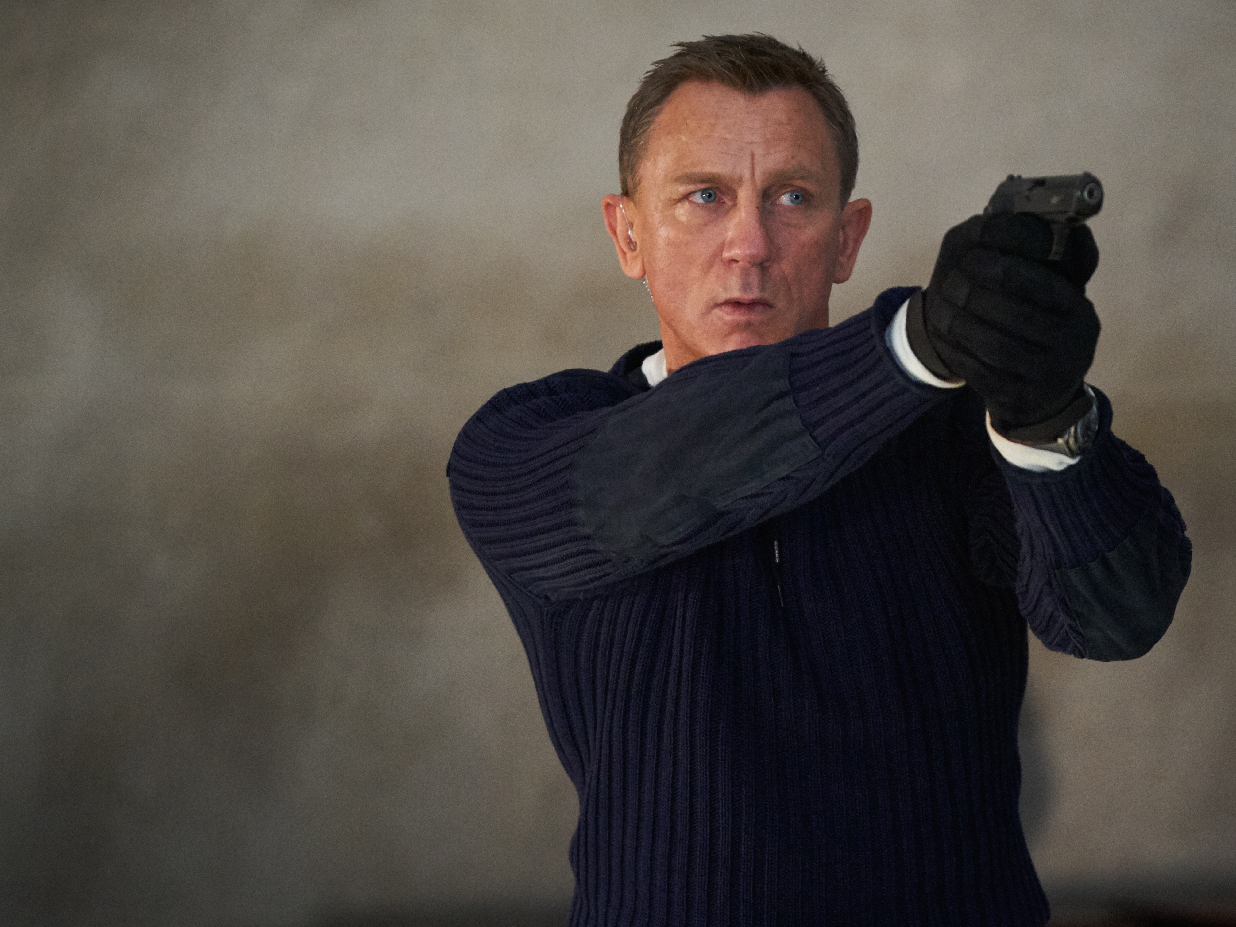 caption: Daniel Craig as James Bond in No Time to Die.