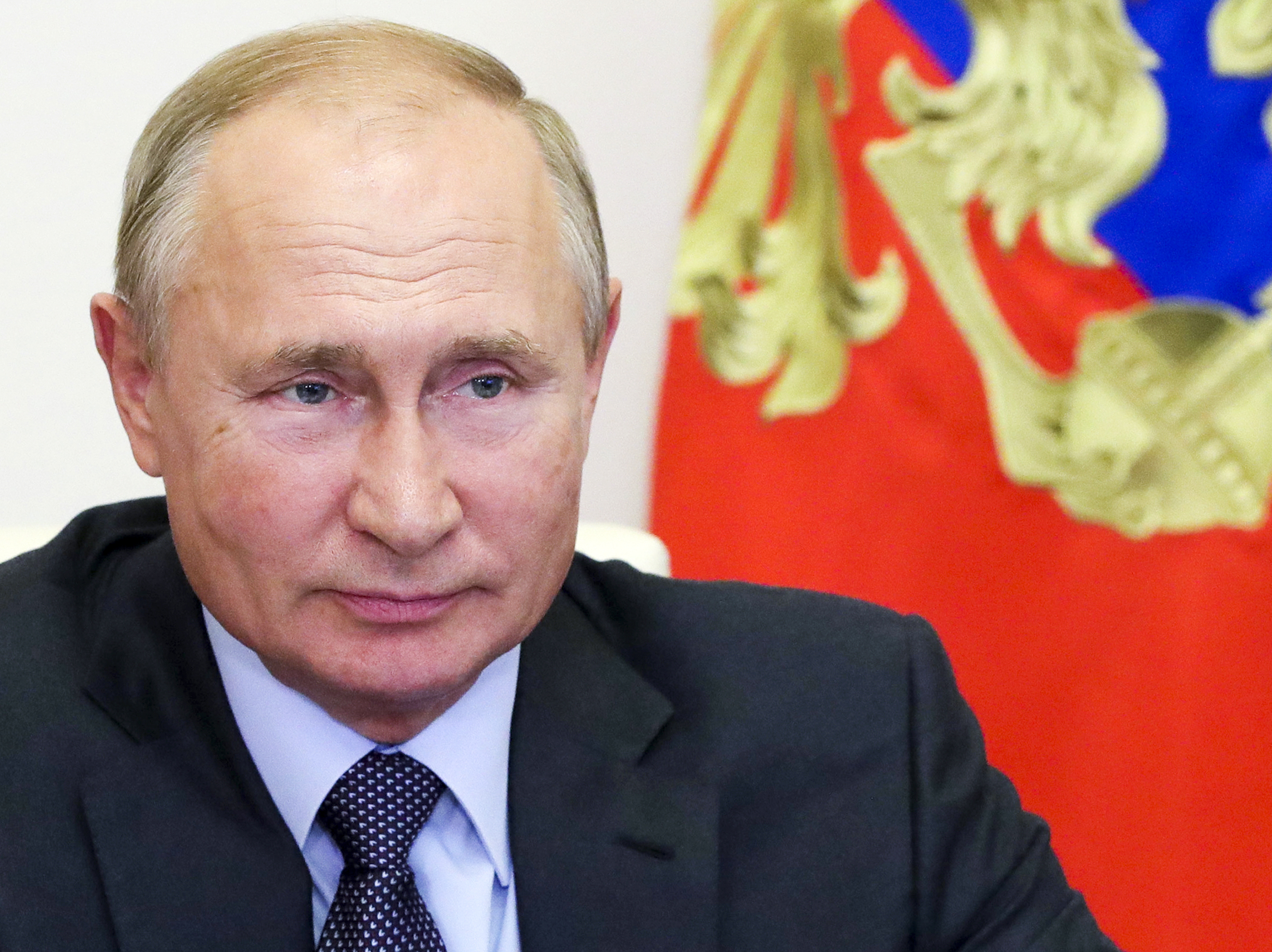 caption: Russian President Vladimir Putin attends a meeting on economic issues via video conference at the Novo-Ogaryovo residence outside Moscow on Thursday.