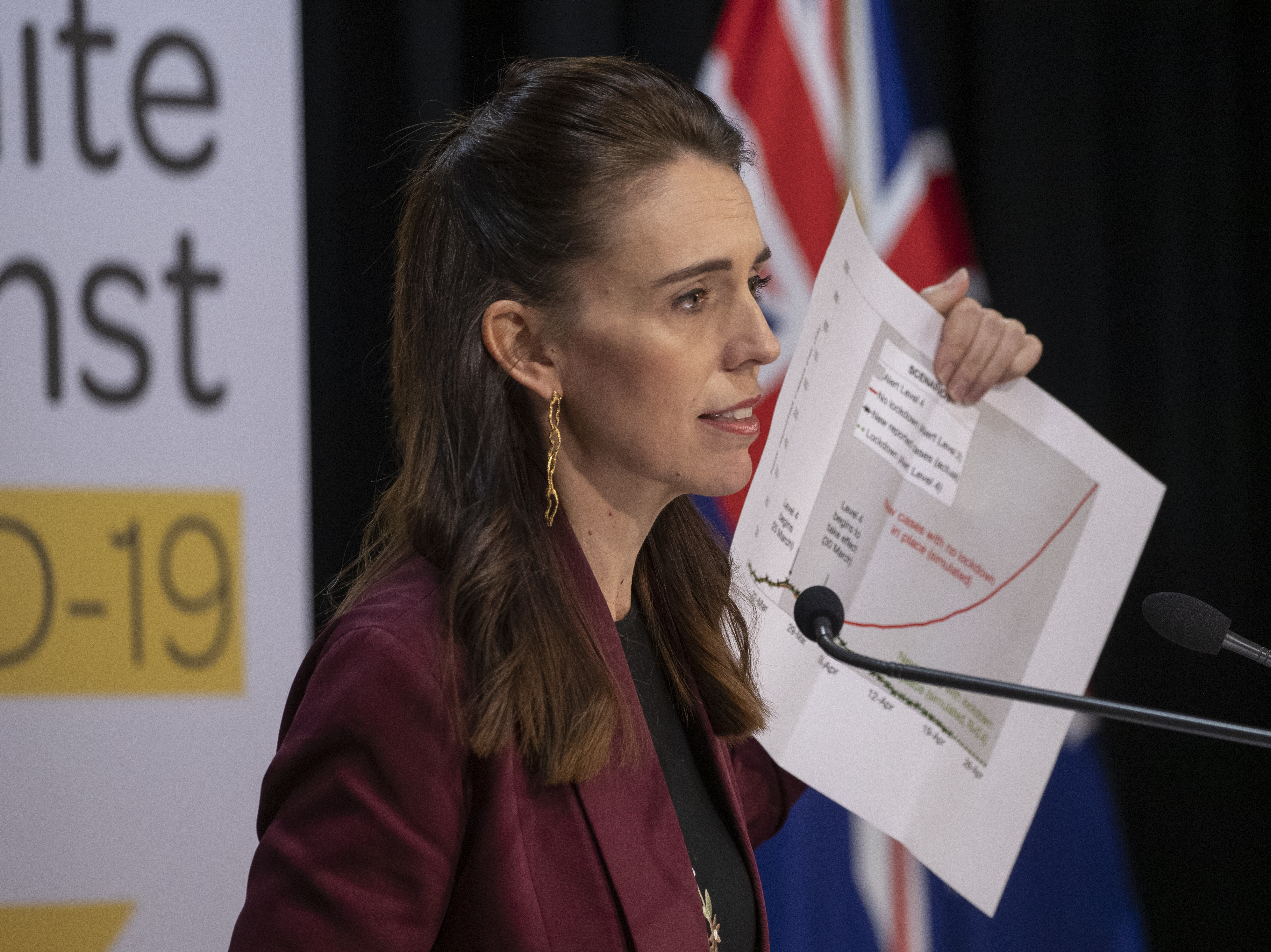 caption: Prime Minister Jacinda Ardern speaks at a briefing on the coronavirus pandemic at Parliament on Monday in Wellington, New Zealand.
