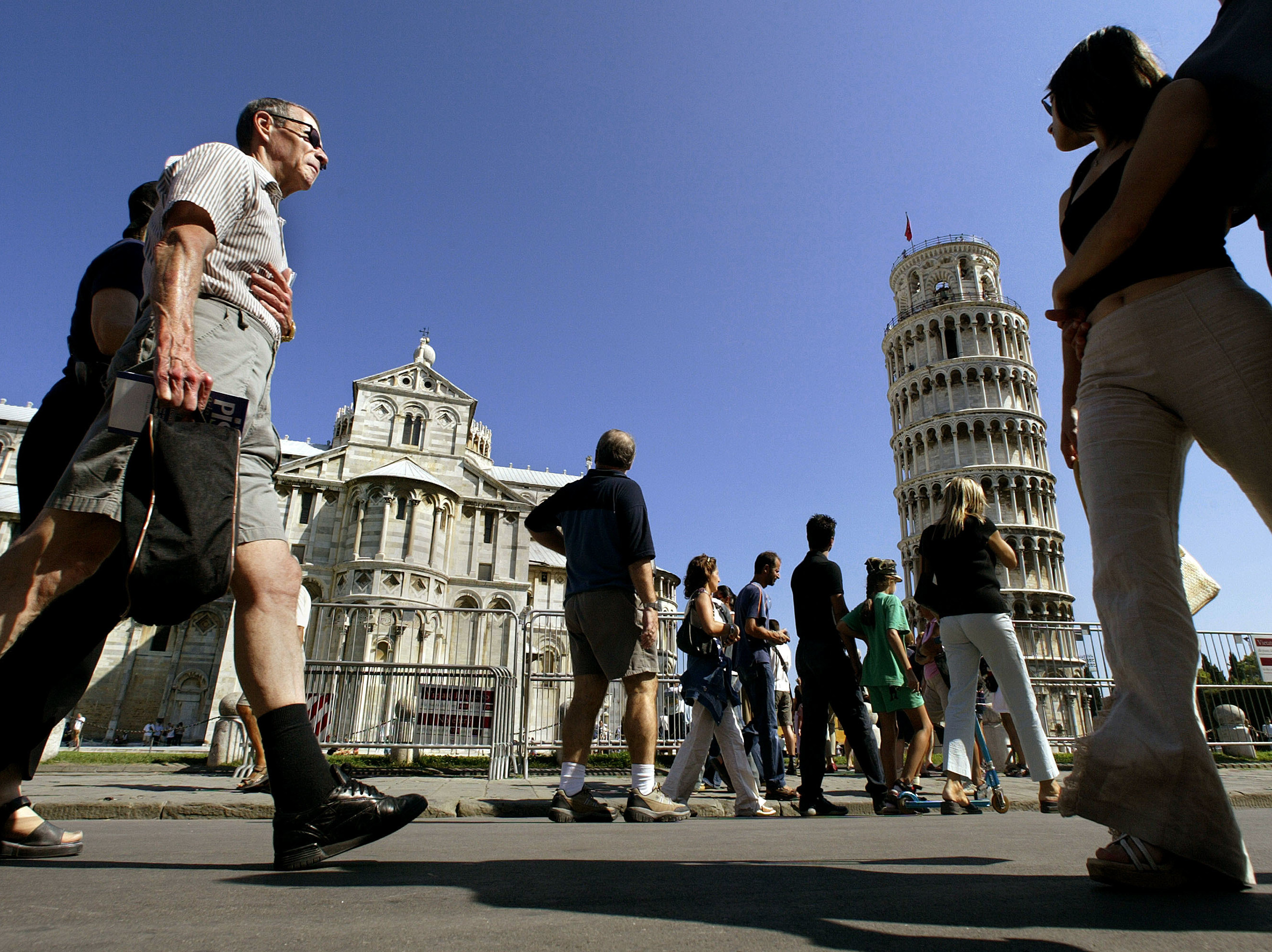 caption: Pisa's Square of Miracles with cathedral and Leaning Tower.