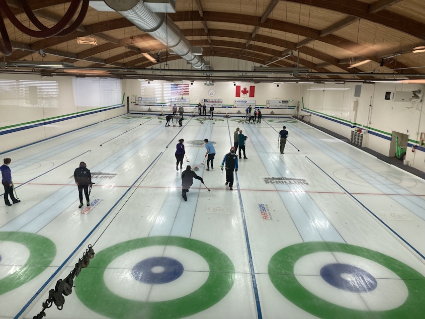 caption: People curling at the Granite Curling Club in Seattle.