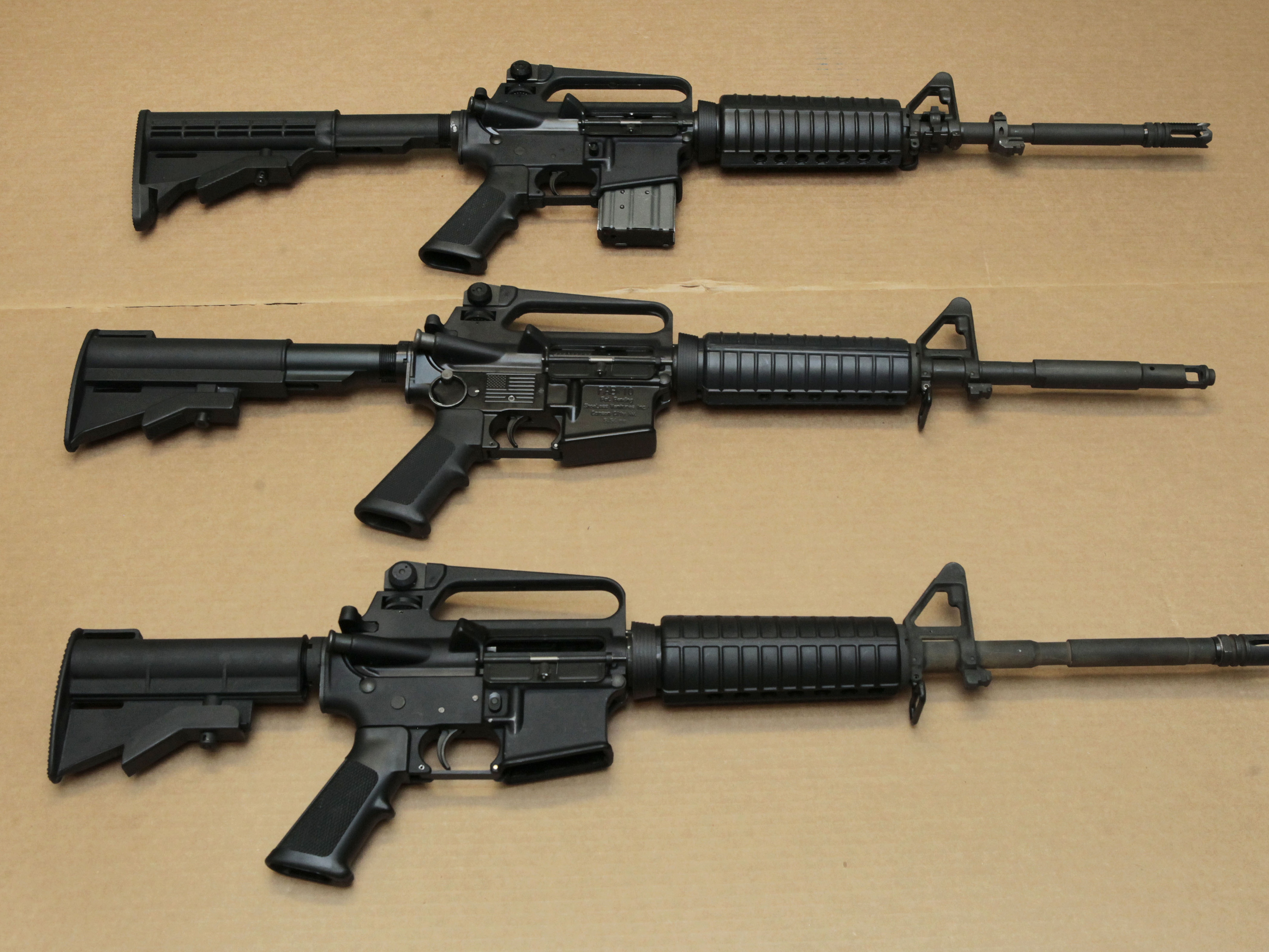 caption: Three variations of the AR-15 assault rifle are displayed at the California Department of Justice in 2012. A federal appeals court on Tuesday upheld Maryland's decade-old ban on military-style firearms commonly referred to as assault weapons.
